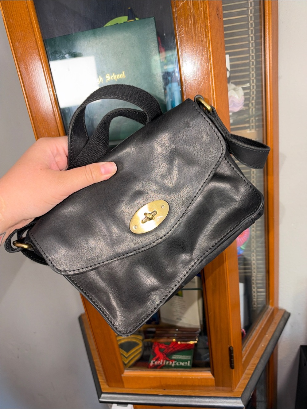 Black Leather Crossbody Bag with Gold Turnlock Accent